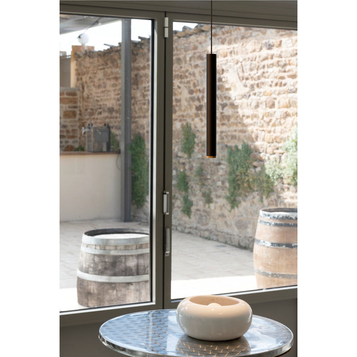 Modern black cylinder pendant light fixture, suspended.