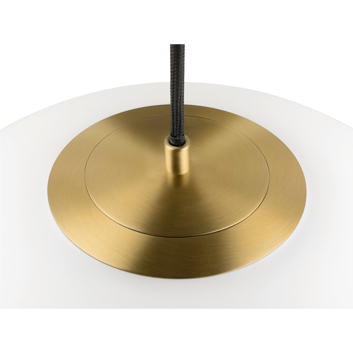 Pendant light detail: white shade, brass canopy with brushed finish, and black cord.