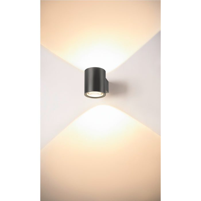 Cylindrical wall-mounted light fixture, dark gray finish.