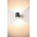 Cylindrical wall-mounted light fixture, dark gray finish.