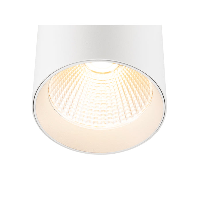 White cylindrical surface-mounted light fixture with textured interior.