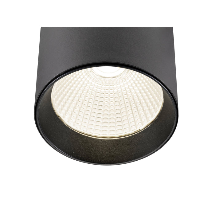 Black cylinder surface-mounted light fixture, metal with textured finish.