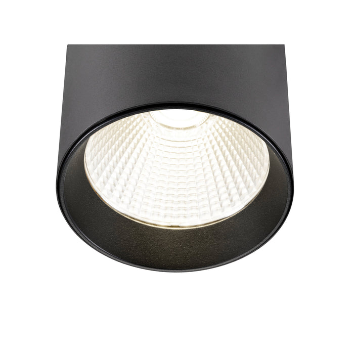 Black cylinder surface-mounted LED downlight with textured finish.