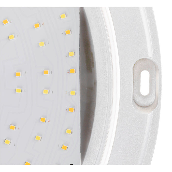 Close-up of a white LED light fixture with a mounting slot.