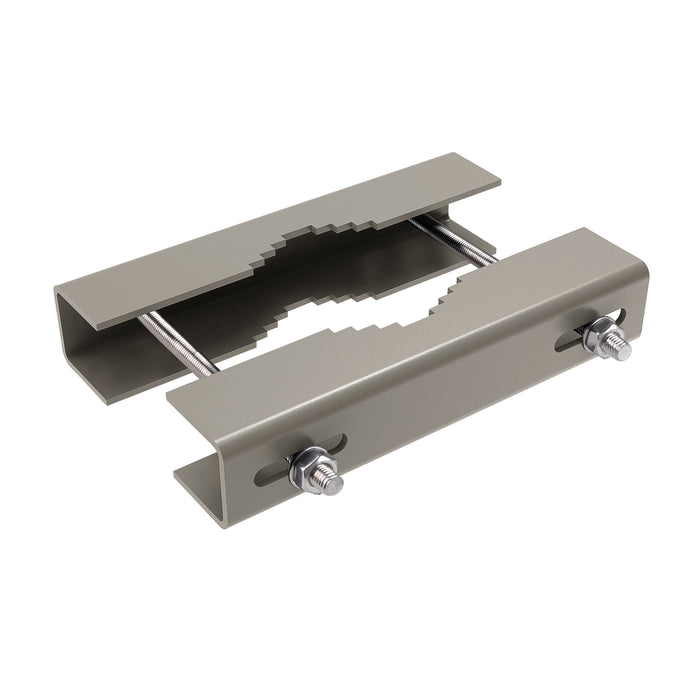 Gray steel pipe clamp with serrated edges, threaded rods, and bolt mounting.