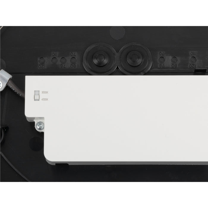 Black plastic light fixture back with white LED module and color temperature switch.