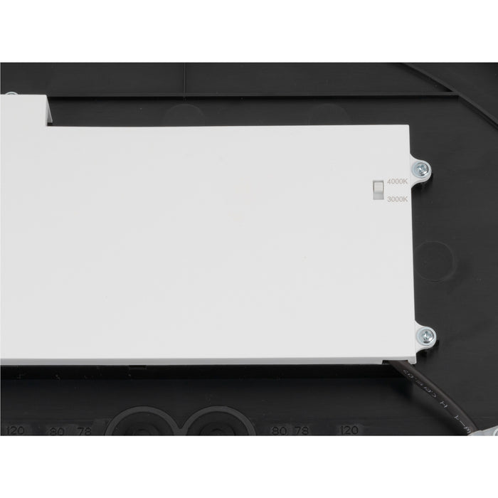 Close-up of a black and white LED fixture showing the color temperature switch (3000K/4000K).