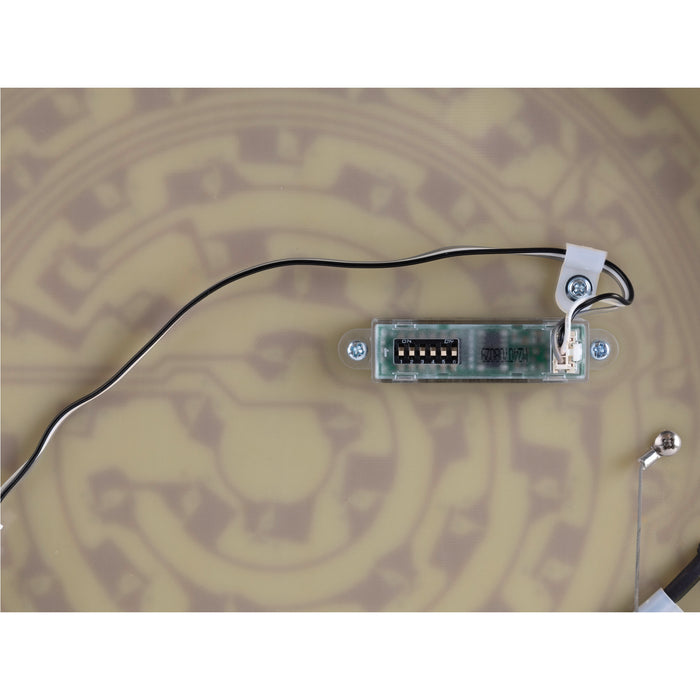 Circuit board with mounted dip switch, wiring, and metal ball joint.