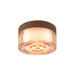 Glass flush mount ceiling light with brown cork trim and amber hue.