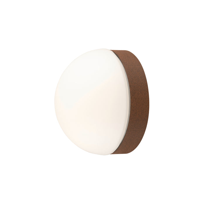 Wall-mounted light fixture with white glass shade and brown cork base.