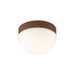 Flush mount ceiling light with cork trim and white glass diffuser.