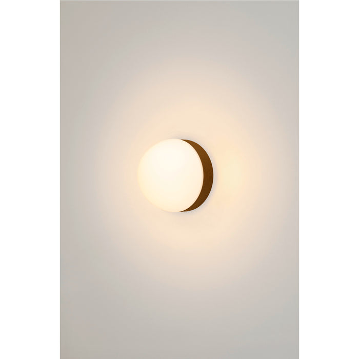 White glass orb wall sconce with bronze finish metal mount.