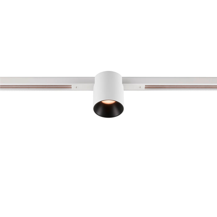 White cylinder track lighting fixture.