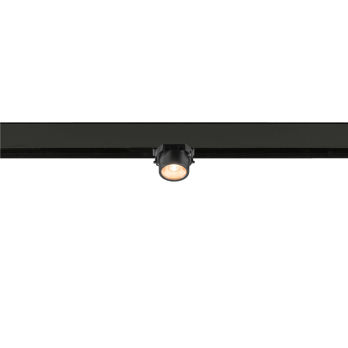 Black track lighting fixture with a round head, mounted on a track.