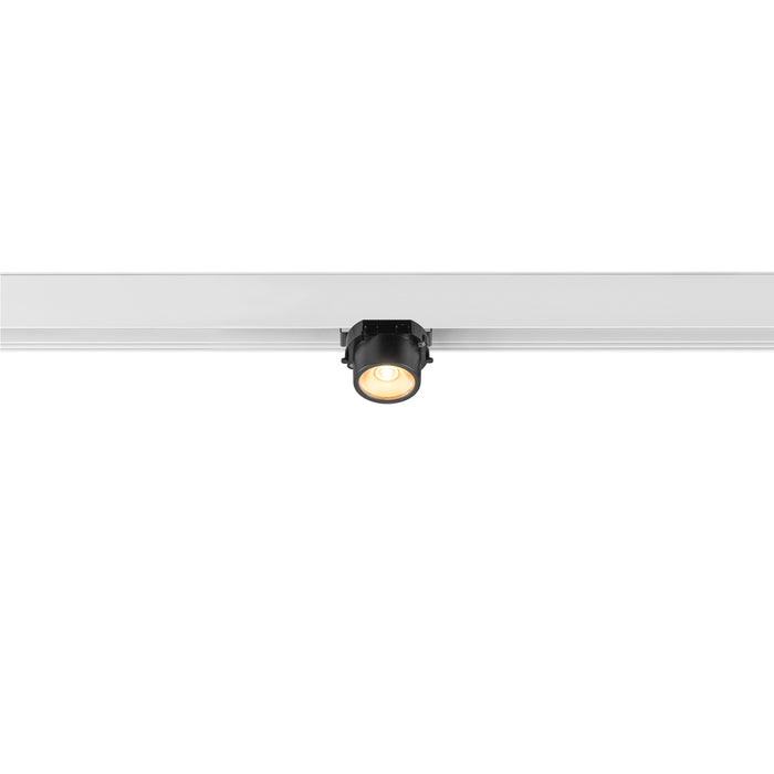 Black track lighting fixture mounted on a white track.