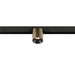 Bronze cylinder track lighting fixture, mounted on black track.