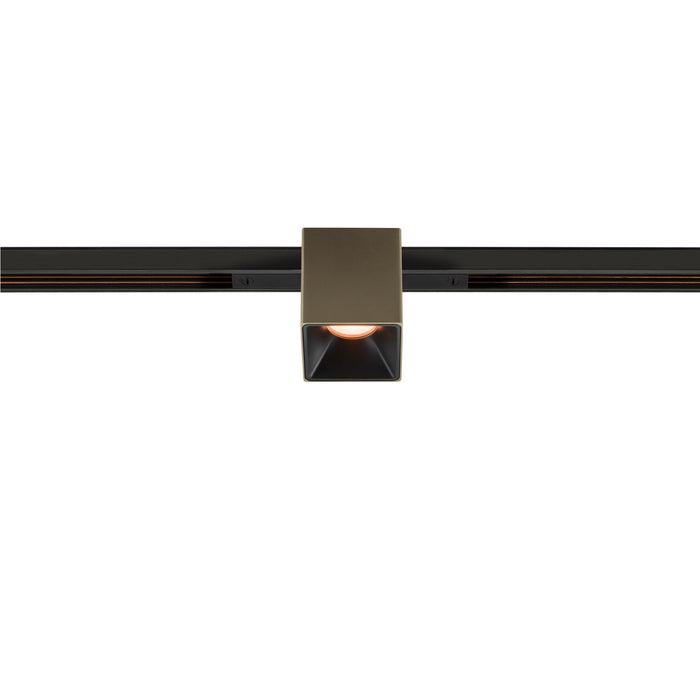 Bronze finish square track lighting head mounted on black track.