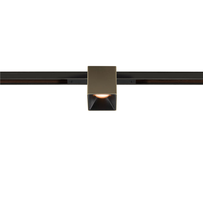 Bronze finish square track lighting head mounted on black track.