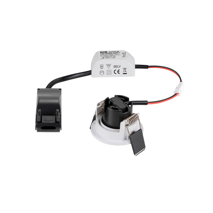 Recessed LED downlight with white trim, black heat sink, and external power supply.