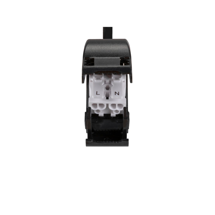 Black plastic electrical switch with white terminals labeled L and N.