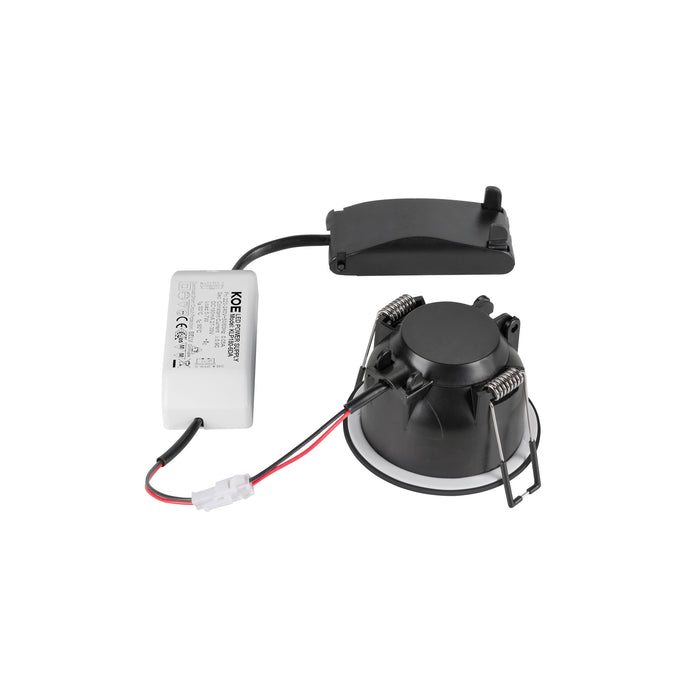 Black recessed LED downlight with spring mounting clips and separate power supply.