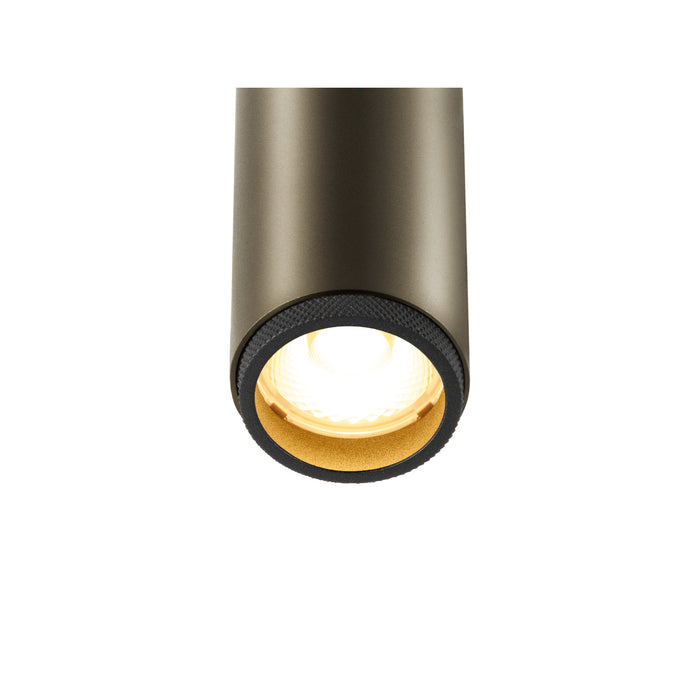 Aluminum cylinder downlight, bronze finish, surface mounted.