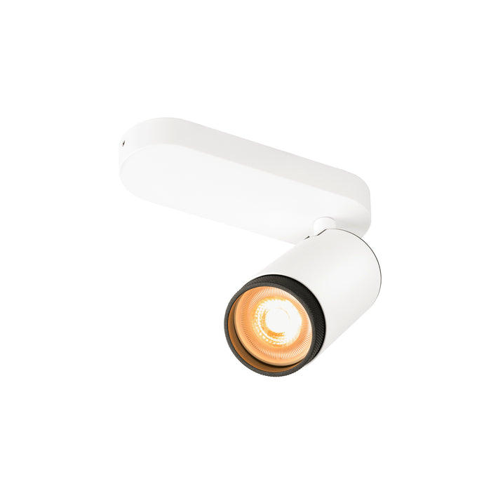 White metal track light fixture with cylindrical head and adjustable mounting.