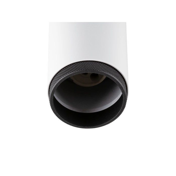 White cylinder surface-mounted light fixture with black textured trim.