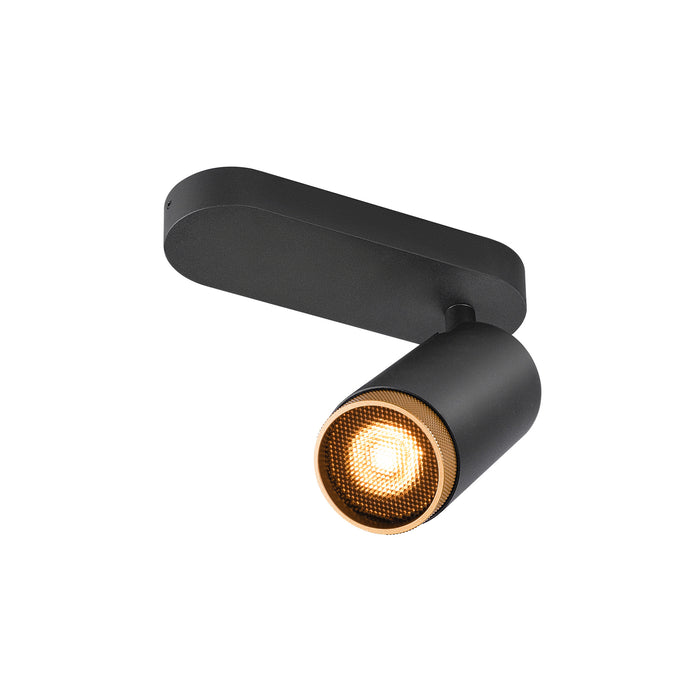 Black metal track light fixture with gold honeycomb lens detail, surface mounted.