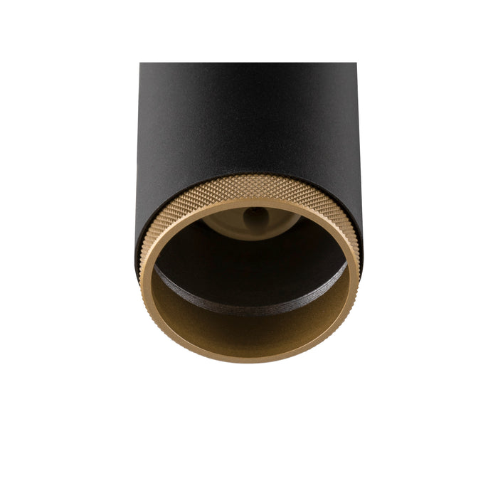 Black and gold metal cylinder downlight fixture.