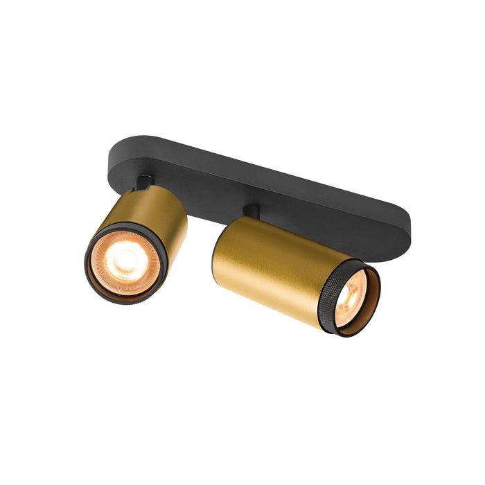 Surface-mounted spotlight with two adjustable gold-colored metal heads and a matte black base.