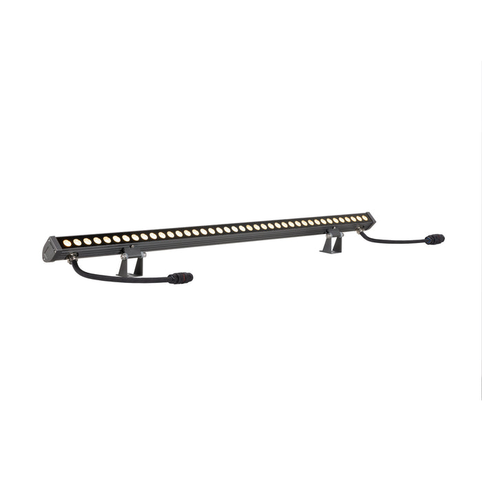 Gray aluminum LED wall wash light fixture with mounting brackets.