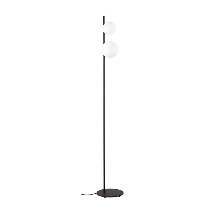 Black metal floor lamp with two white glass globe shades.