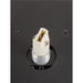Close-up of a black metal fixture with a white plastic socket and threaded metal base.