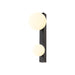 Black metal wall sconce with two round, white glass shades.