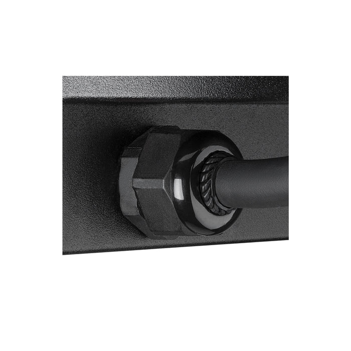 Close-up of a black metal wall mount with a black cable running through a glossy black fitting.