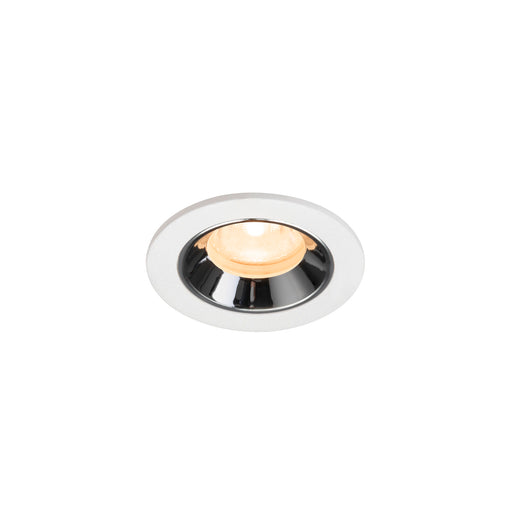 Recessed ceiling light fixture with a white metal body, chrome finish, and warm white LED bulb.