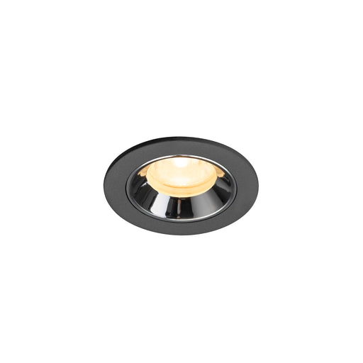 Recessed ceiling light fixture in black metal with a chrome finish and warm white bulb, designed for flush mounting.