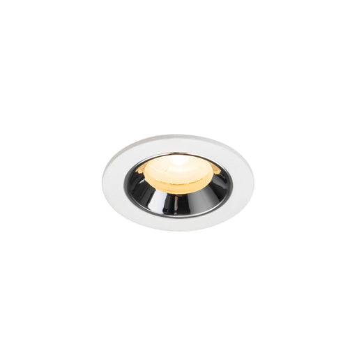 Recessed ceiling light fixture with a chrome finish, white metal housing, and warm yellow LED bulb.