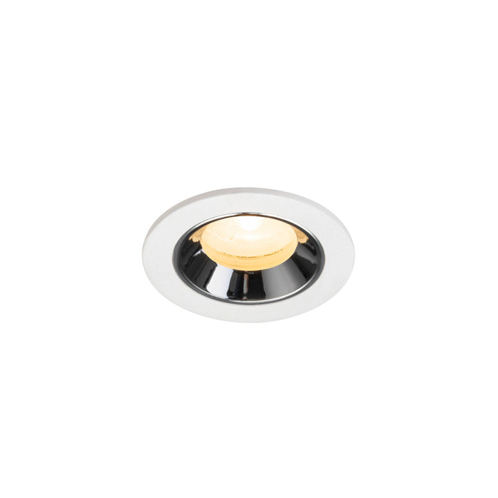 Recessed ceiling light fixture with a chrome finish, white metal housing, and warm yellow LED bulb.