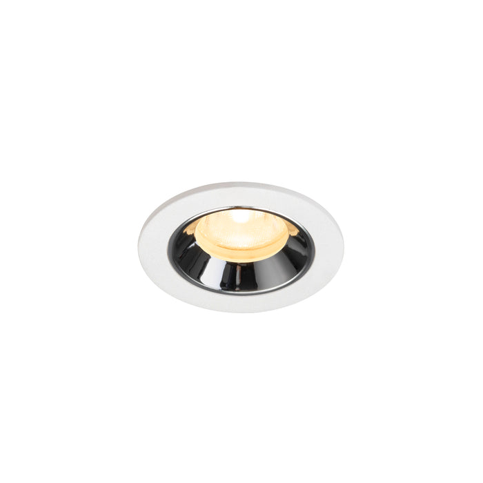 Recessed ceiling light fixture with a chrome finish, white metal trim, and warm LED bulb.