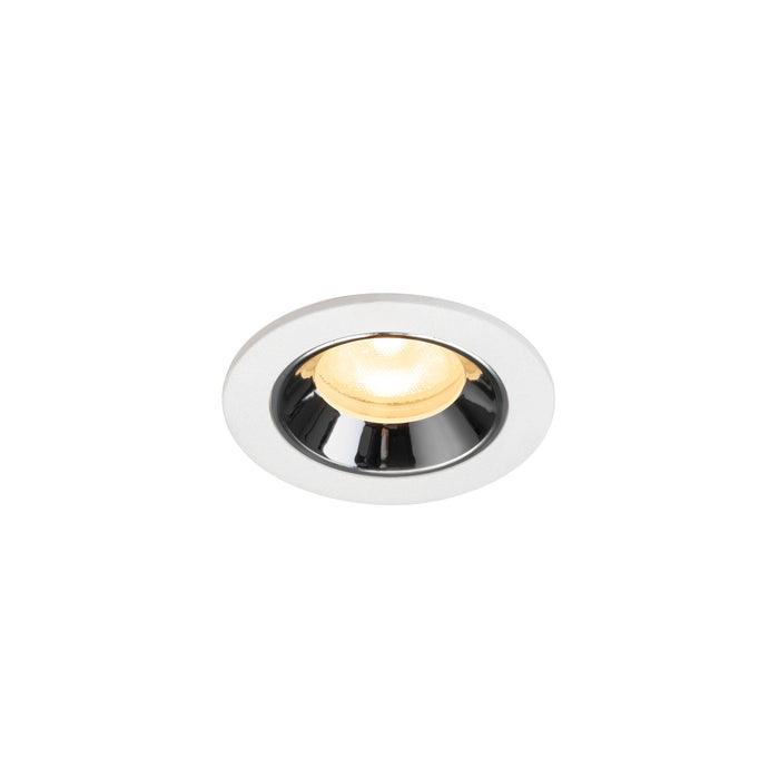 Recessed ceiling light fixture with a white metal finish and chrome accents, featuring a warm yellow bulb.