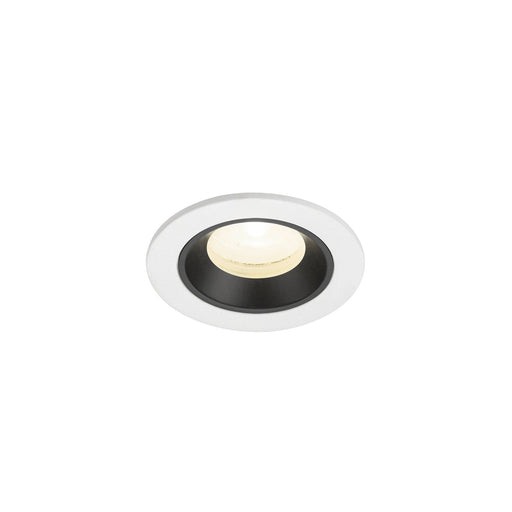 Recessed ceiling light fixture with a white metal finish and black interior, featuring a warm white LED bulb for efficient illumination.