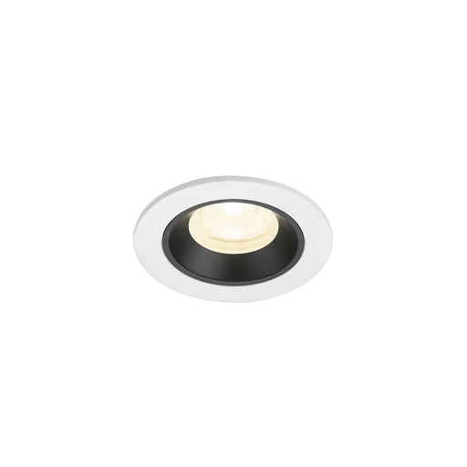 Recessed ceiling light fixture with a white and black finish, made of metal, featuring a round design and warm white LED illumination.