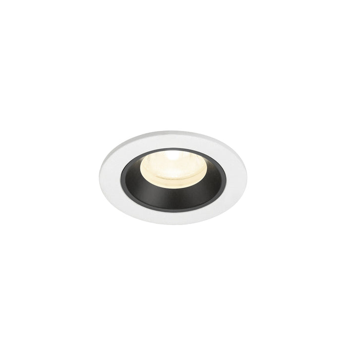 Recessed ceiling light fixture with a white and black finish, made of metal, featuring a round design and warm white LED illumination.
