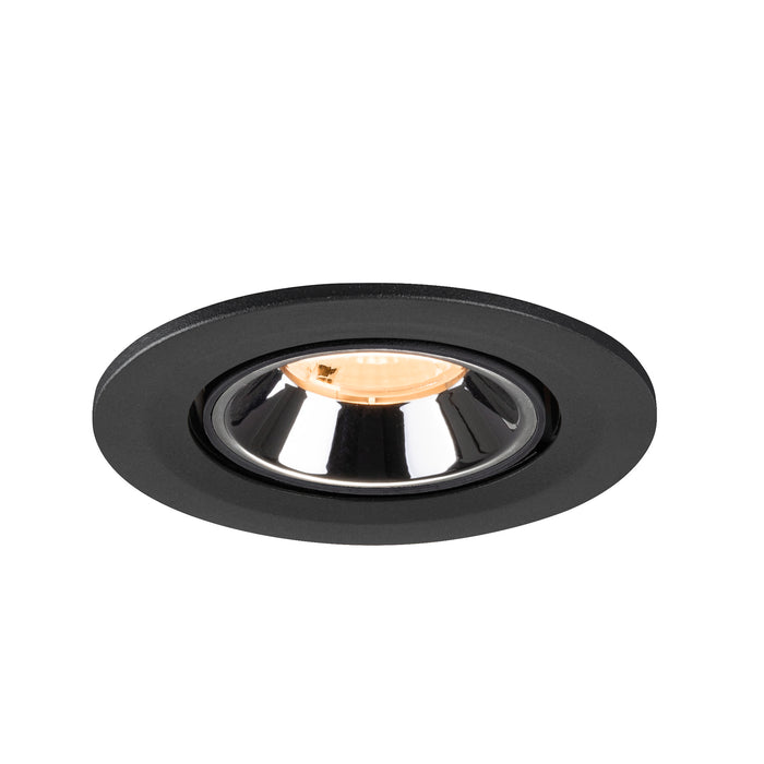 Recessed ceiling light fixture in black metal with a chrome finish and warm white bulb, designed for flush mounting.