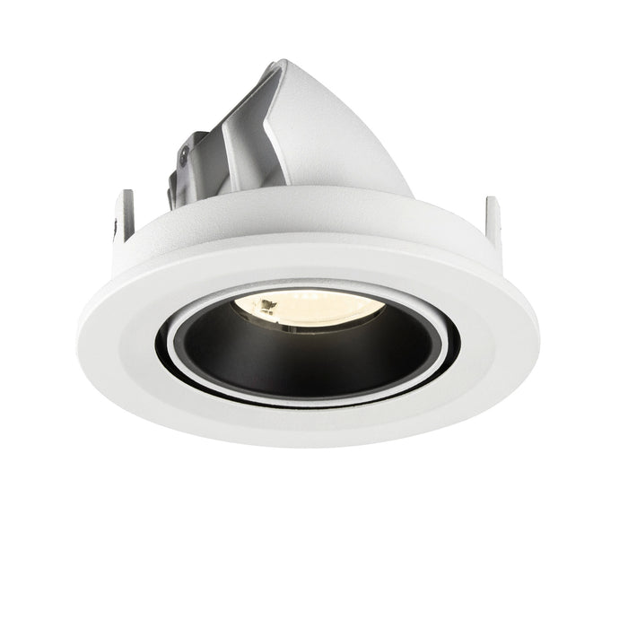Recessed ceiling light fixture in white metal finish with black inner ring, designed for adjustable mounting.