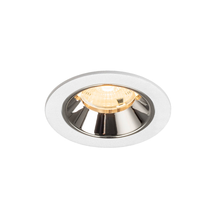 Recessed ceiling light fixture with a chrome finish, white metal trim, and a warm white bulb for modern interior lighting.