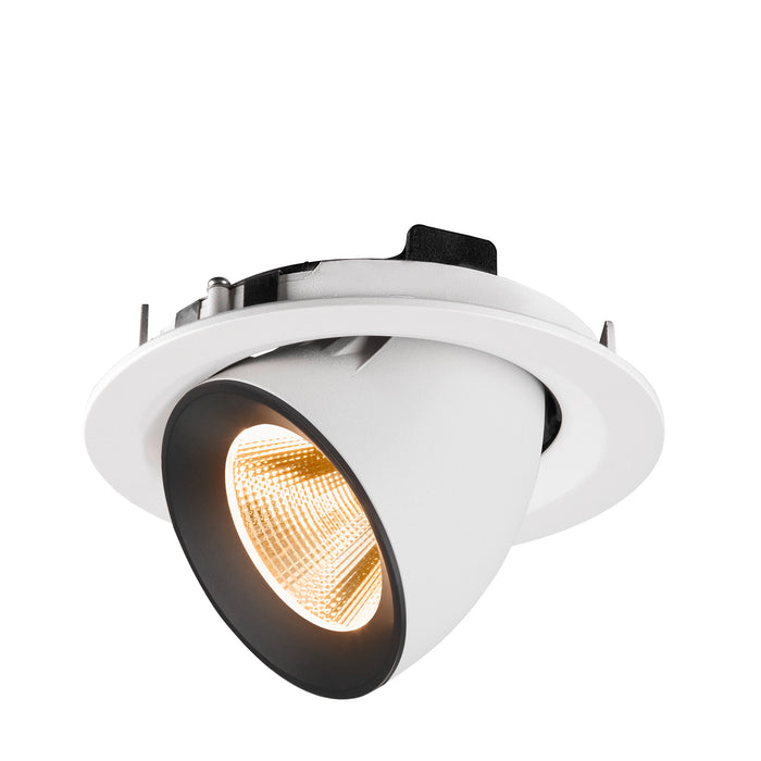 Recessed downlight fixture made of metal with a matte white finish and black trim, featuring a warm LED light source for ceiling mounting.