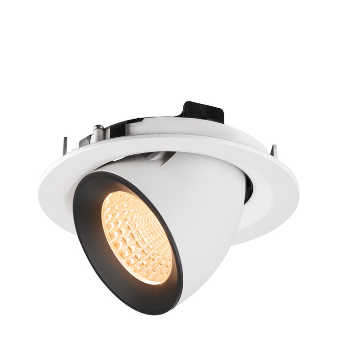 Recessed downlight fixture made of metal with a matte white finish and black trim, featuring a warm LED bulb for ceiling mounting.